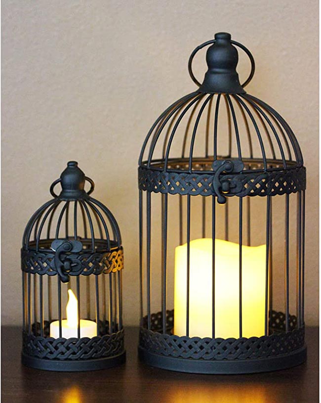 com velas 00 4 Gaiolas pretas com velas brancas.